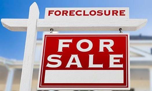 Red & white foreclosure sign