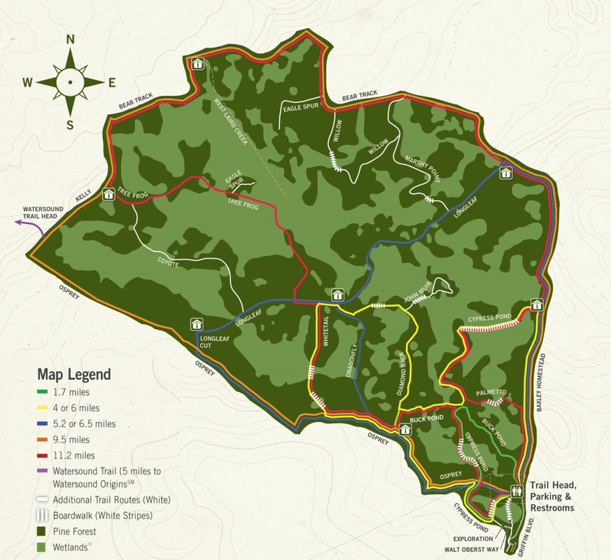 park map with multiple trails marked in white, red, yellow and blue